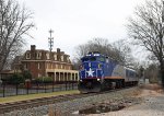 RNCX 105 leads train P073-26 past the historic Page-Walker hotel